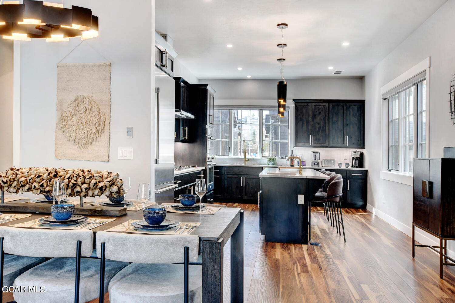 Undisclosed Address Winter Park, CO 80482 - Photo 8 of 52 a view of a dining room with furniture and wooden floor