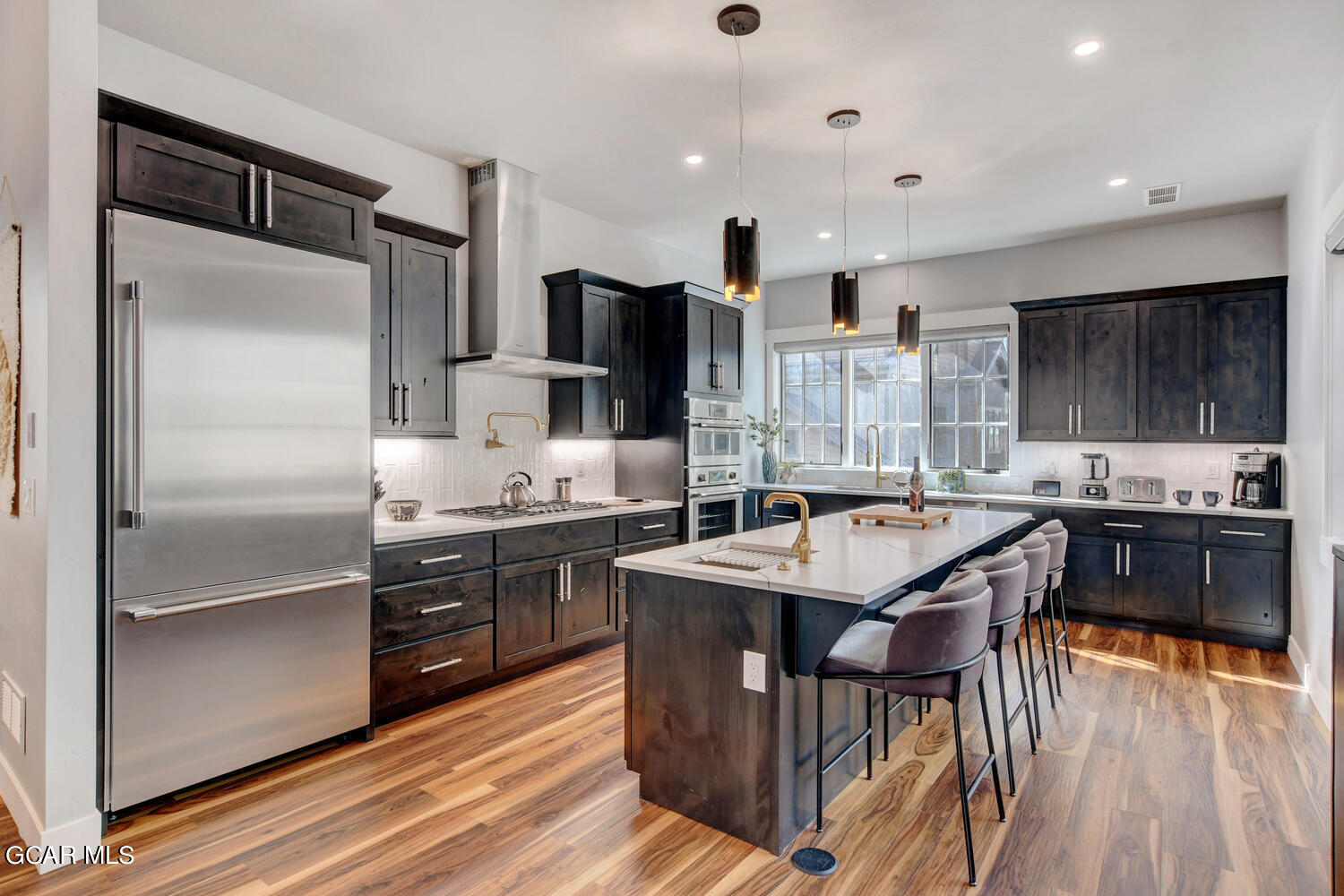 Undisclosed Address Winter Park, CO 80482 - Photo 10 of 52 a kitchen with stainless steel appliances granite countertop a stove refrigerator sink and cabinets