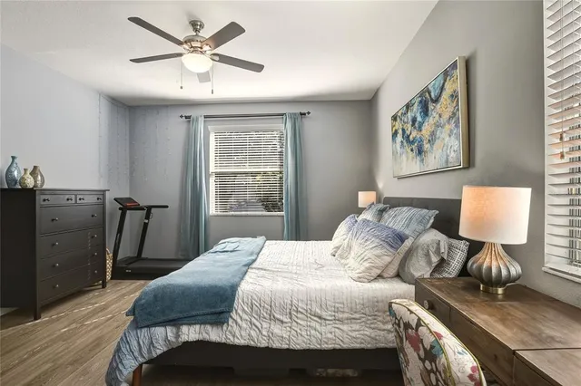 a bathroom with a granite countertop sink mirror and shower