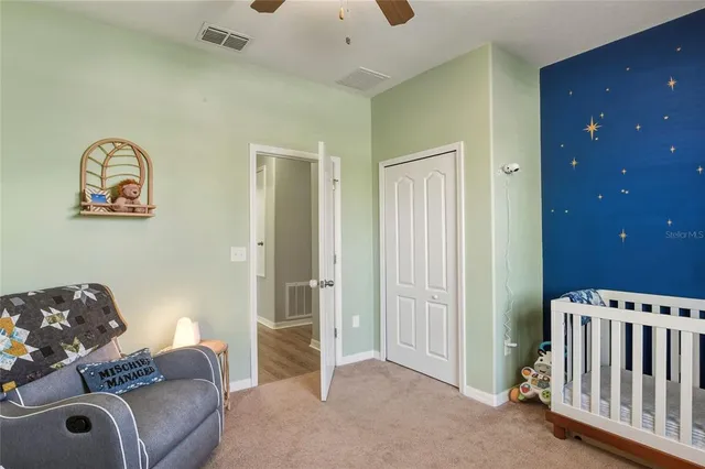 a bedroom with furniture and a bed