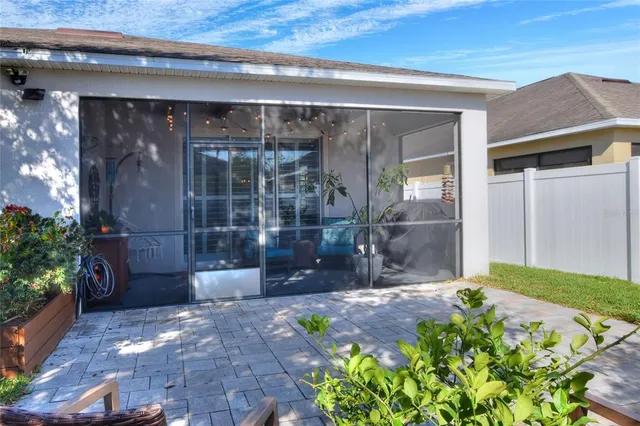 a view of a chair and table in the backyard