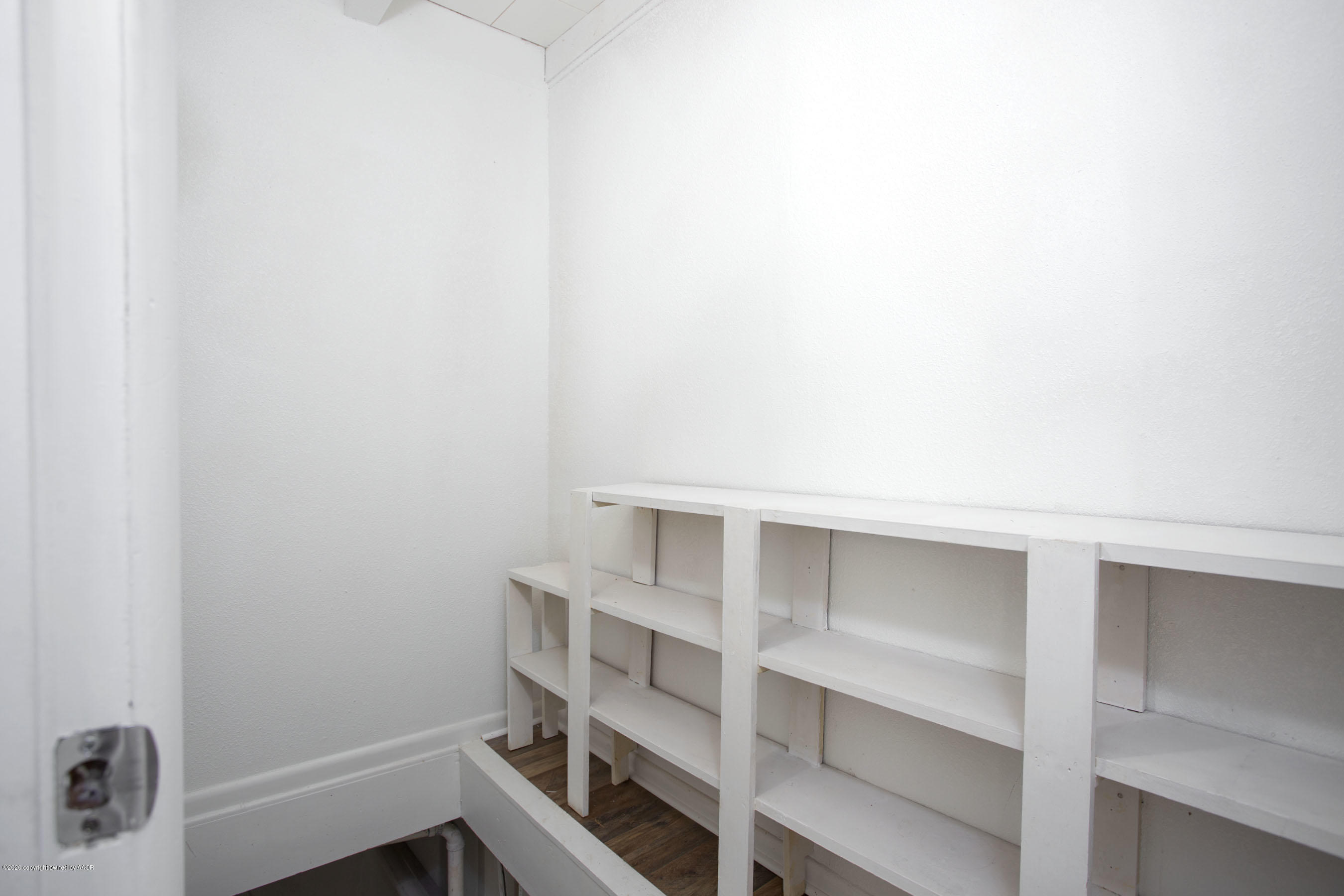 4408 South Travis Street Amarillo, TX 79110 - Photo 19 of 25 a view of an empty walk in closet