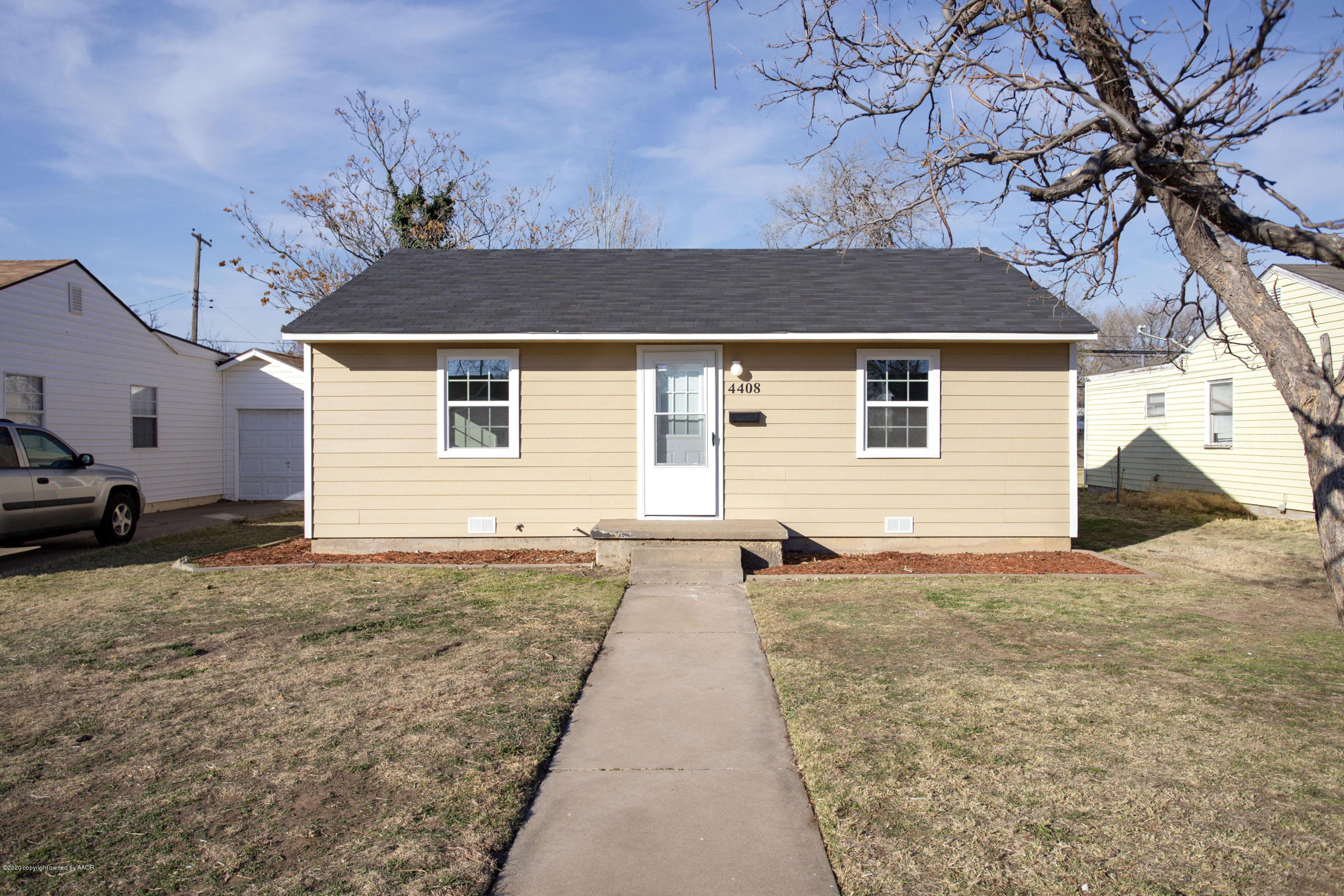 4408 South Travis Street Amarillo, TX 79110 - Photo 2 of 25 a view of a backyard of the house