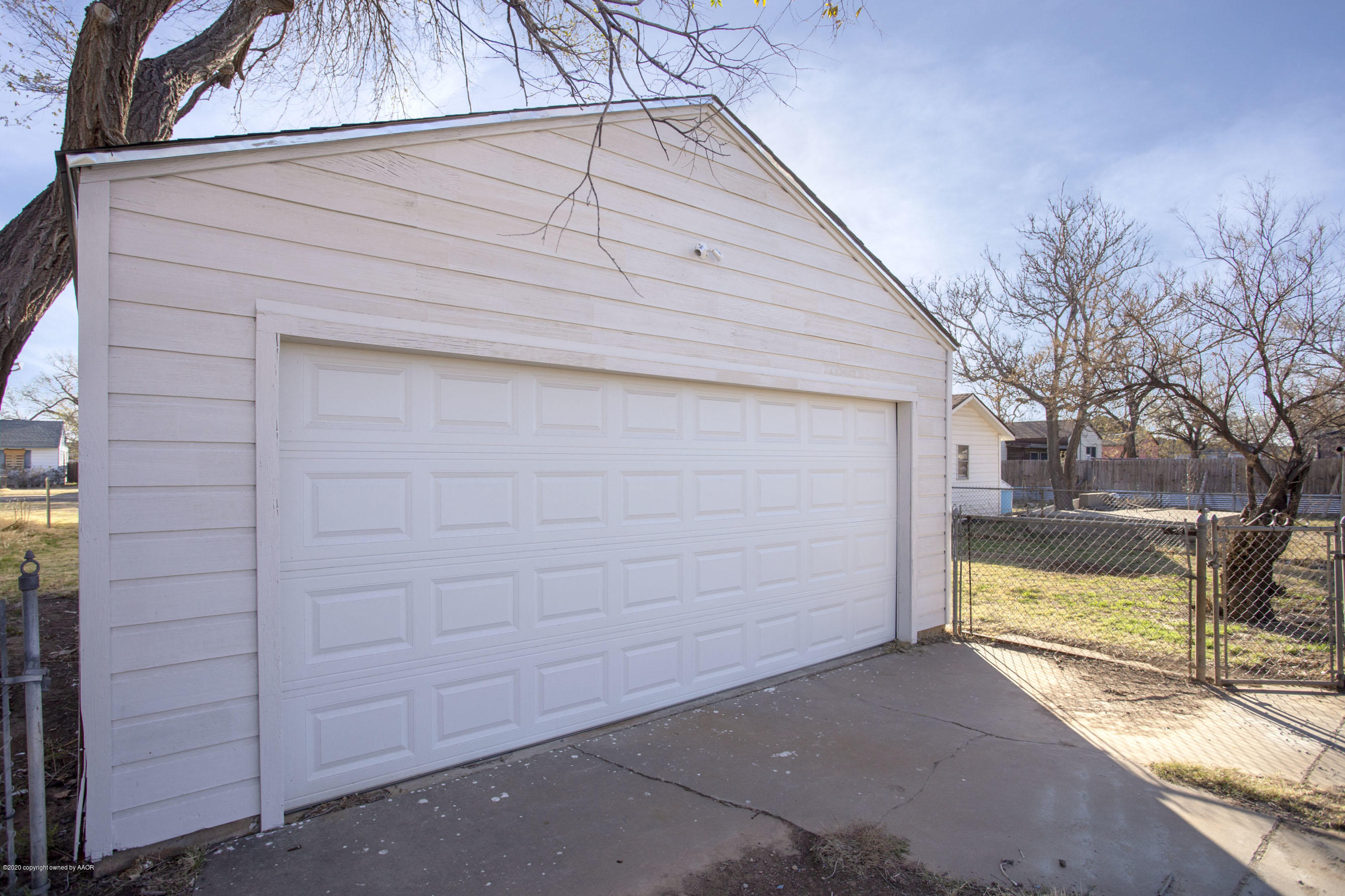 4408 South Travis Street Amarillo, TX 79110 - Photo 23 of 25 a view of house with wooden fence