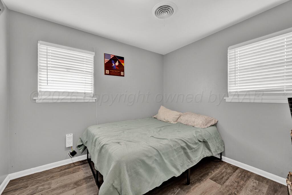 4613 South Bryan Street Amarillo, TX 79110 - Photo 13 of 16 a bedroom with a bed and a window