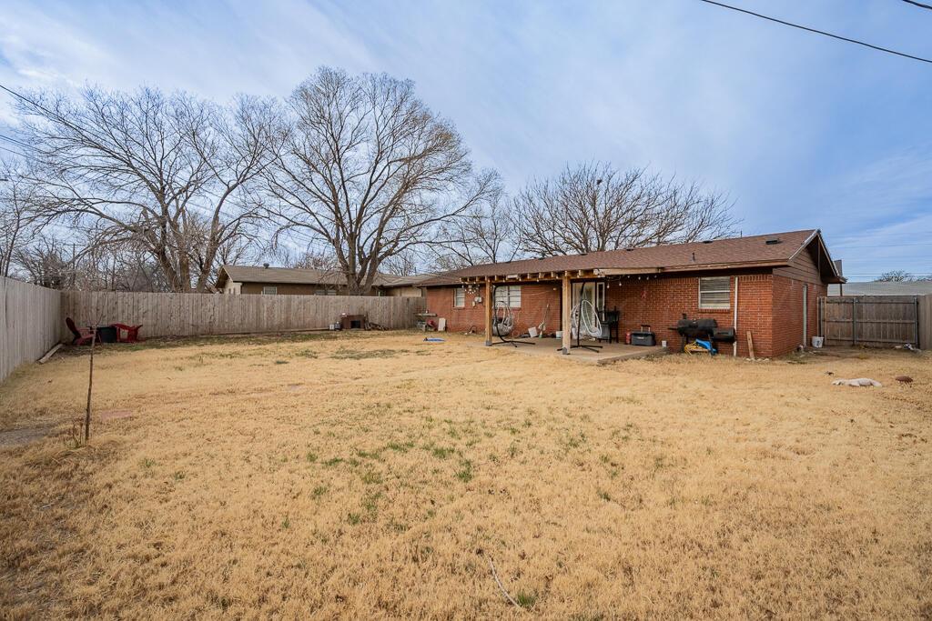 4613 South Bryan Street Amarillo, TX 79110 - Photo 14 of 16 a view of a house with a yard covered in snow