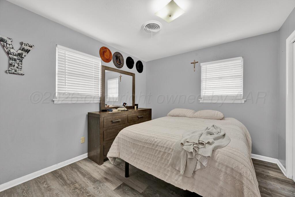 4613 South Bryan Street Amarillo, TX 79110 - Photo 9 of 16 a bed room with a bed and a window