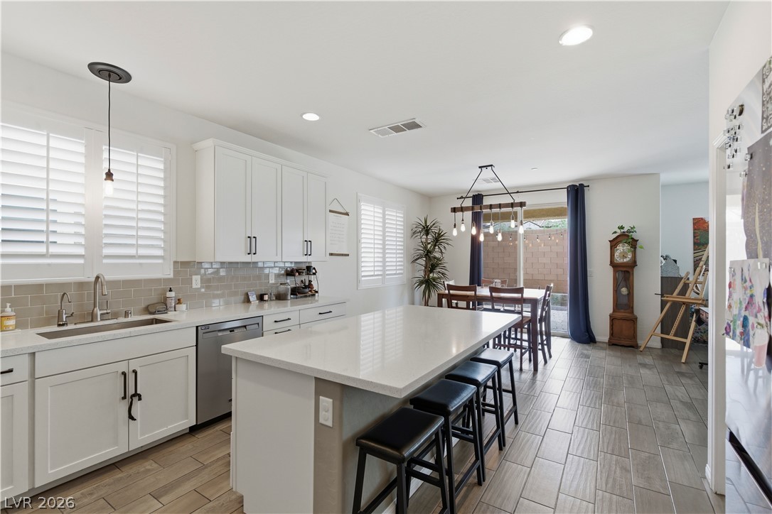 474 Fortissimo Street Henderson, NV 89011 - Photo 1 of 38 Island kitchen open to dining room.