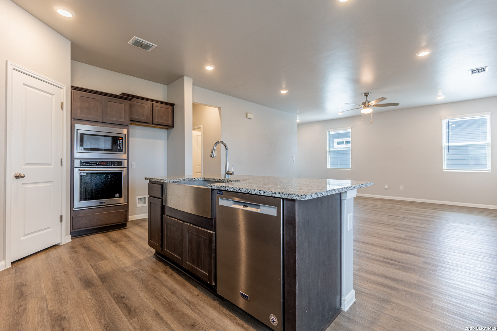 3923 Ivy Path St. Hedwig, TX 78152 - Photo 12 of 32 a kitchen with stainless steel appliances granite countertop a stove and a refrigerator