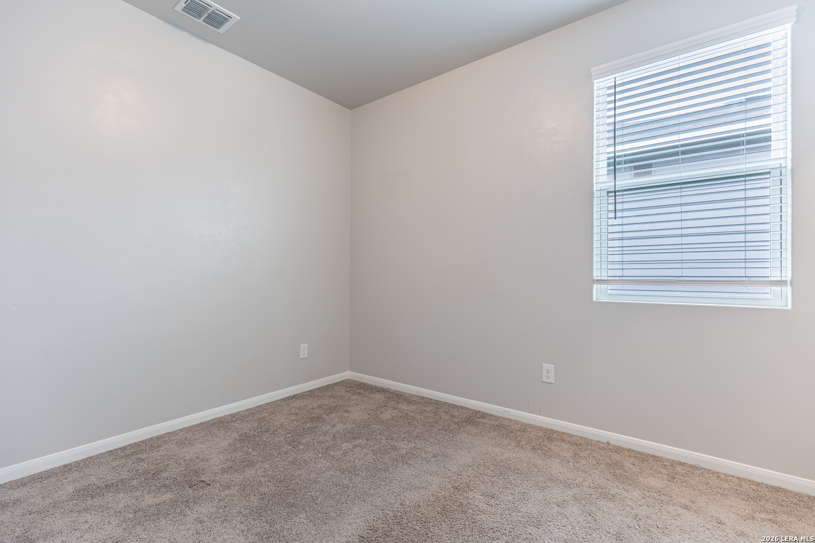3923 Ivy Path St. Hedwig, TX 78152 - Photo 17 of 32 an empty room with a window