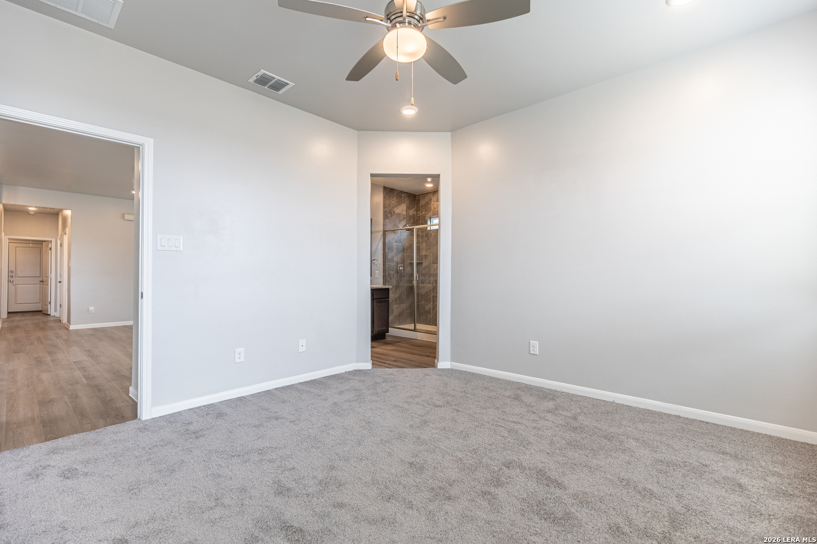 3923 Ivy Path St. Hedwig, TX 78152 - Photo 20 of 32 an empty room with fan and entrance