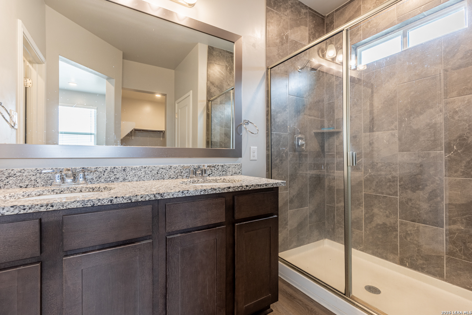 3923 Ivy Path St. Hedwig, TX 78152 - Photo 22 of 32 a bathroom with a sink and a mirror
