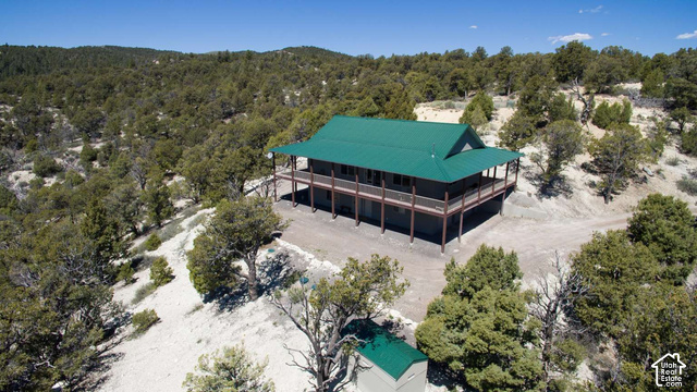 1735 West Pinyon Hls Road Hatch, UT 84735 - Photo 2 of 21 Multi-level residence with a vibrant green roof and an extensive wrap-around deck