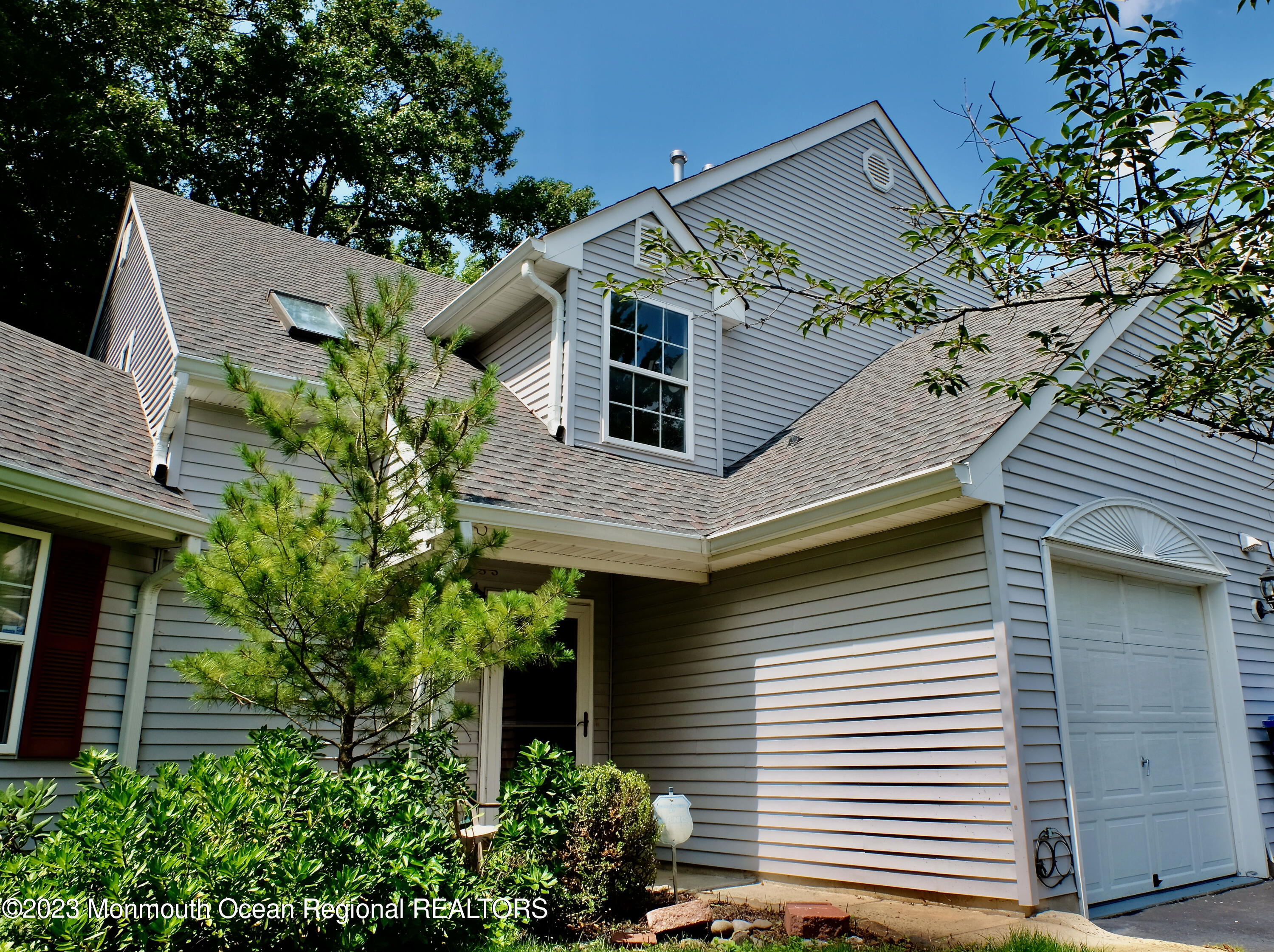 10 Commons Drive Neptune Township, NJ 07753 - Photo 1 of 21 front view of a house with a small yard