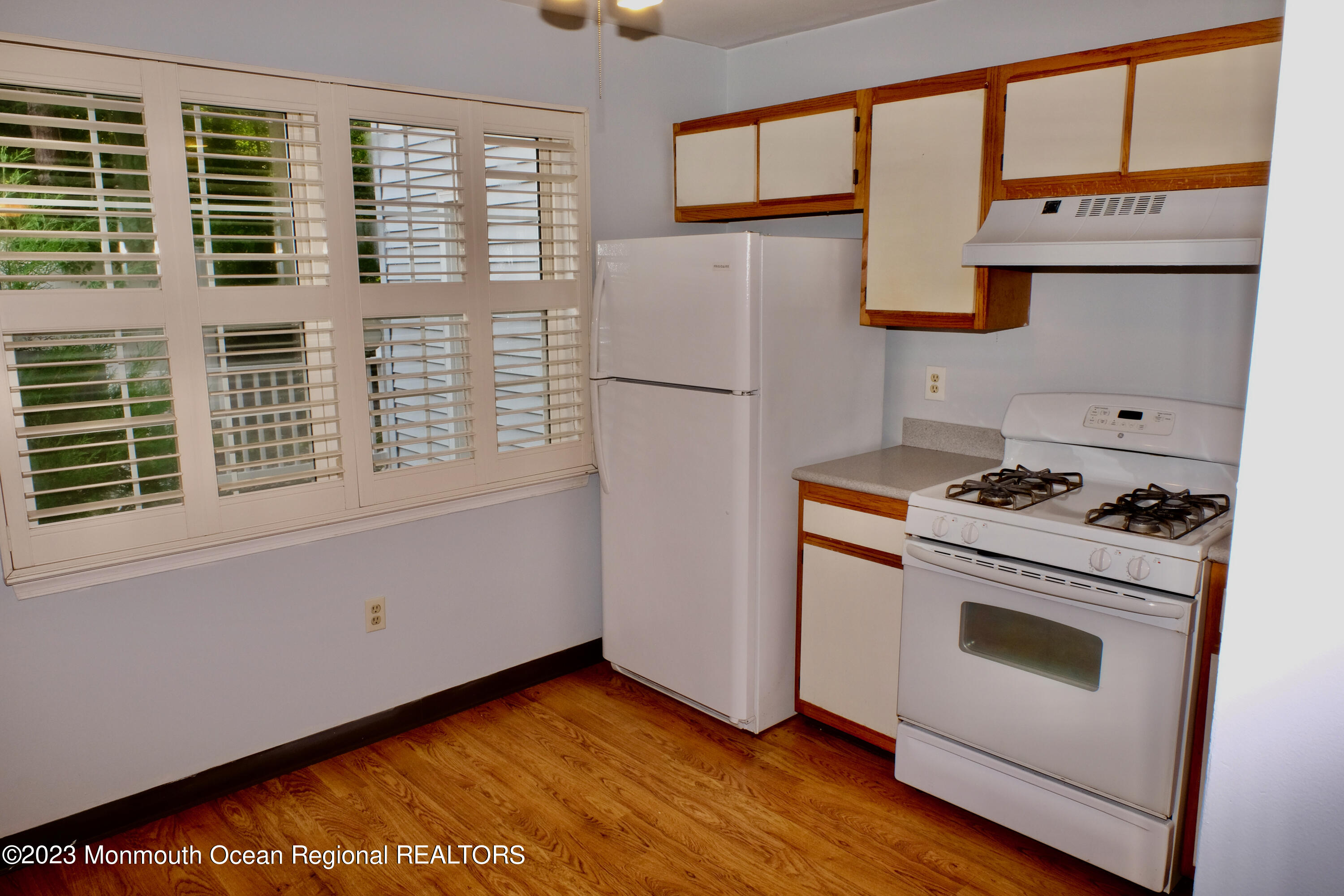 10 Commons Drive Neptune Township, NJ 07753 - Photo 12 of 21 a kitchen with stainless steel appliances a stove and a refrigerator