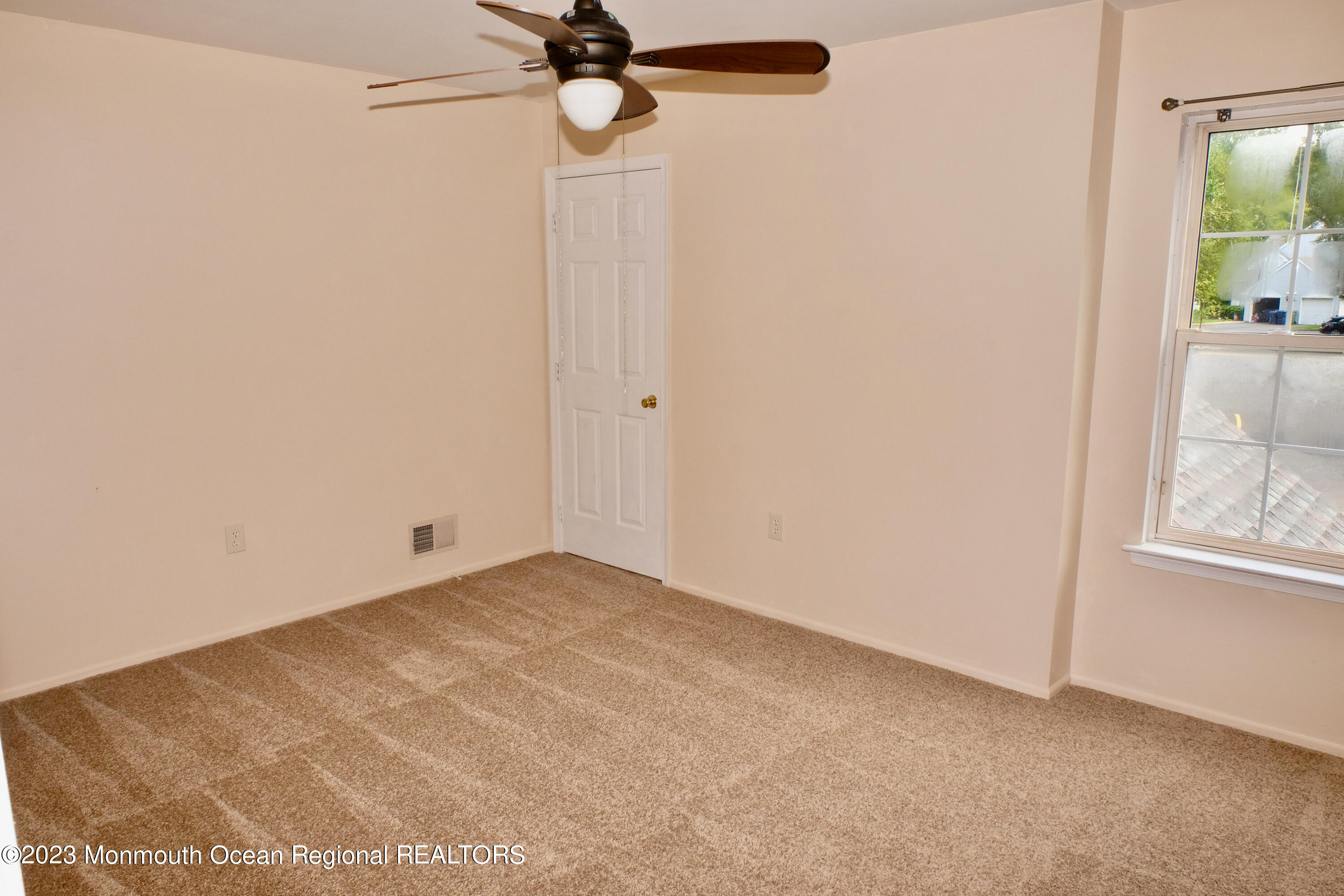 10 Commons Drive Neptune Township, NJ 07753 - Photo 14 of 21 a view of a room with a ceiling fan and a window