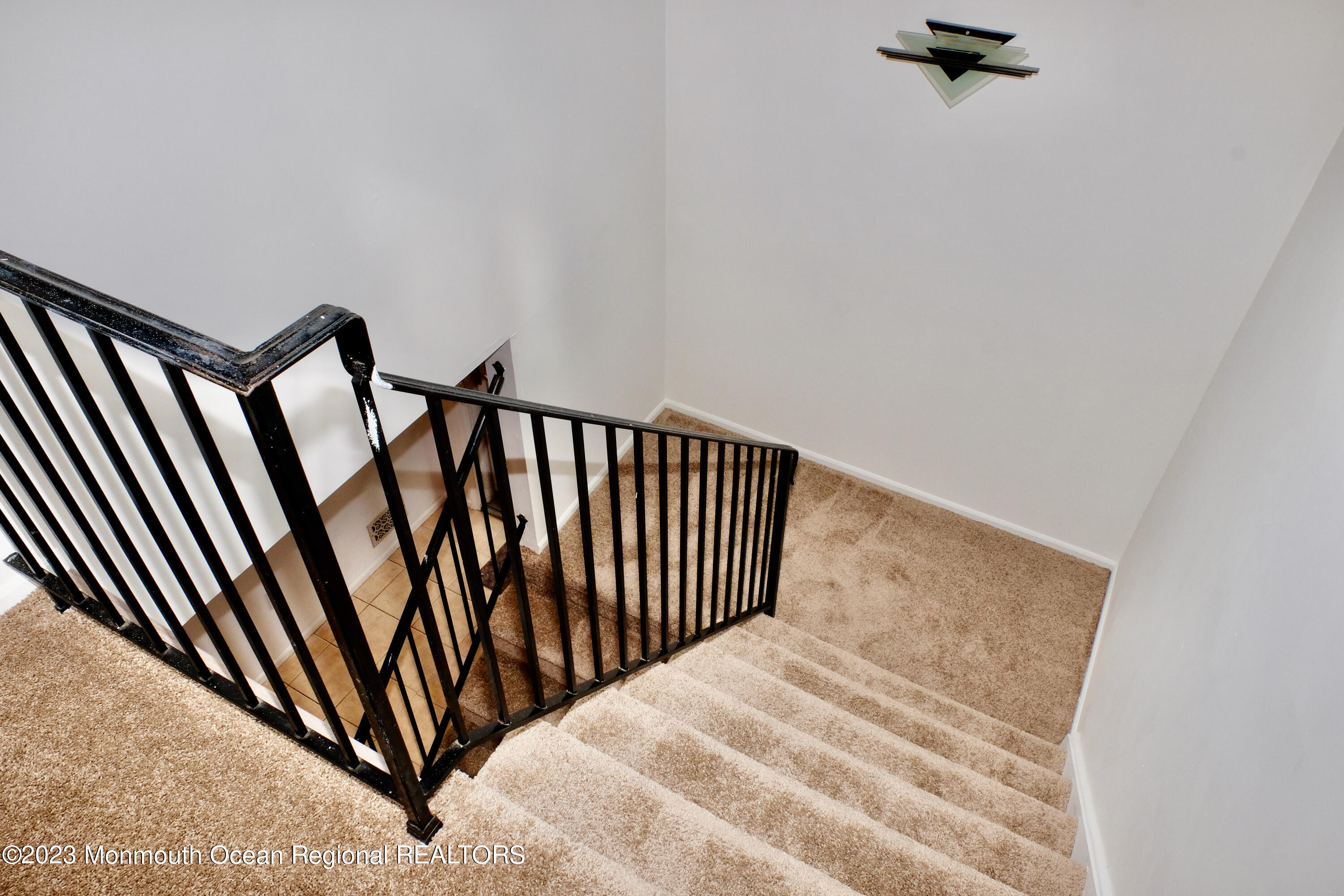 10 Commons Drive Neptune Township, NJ 07753 - Photo 17 of 21 a view of a staircase with white walls