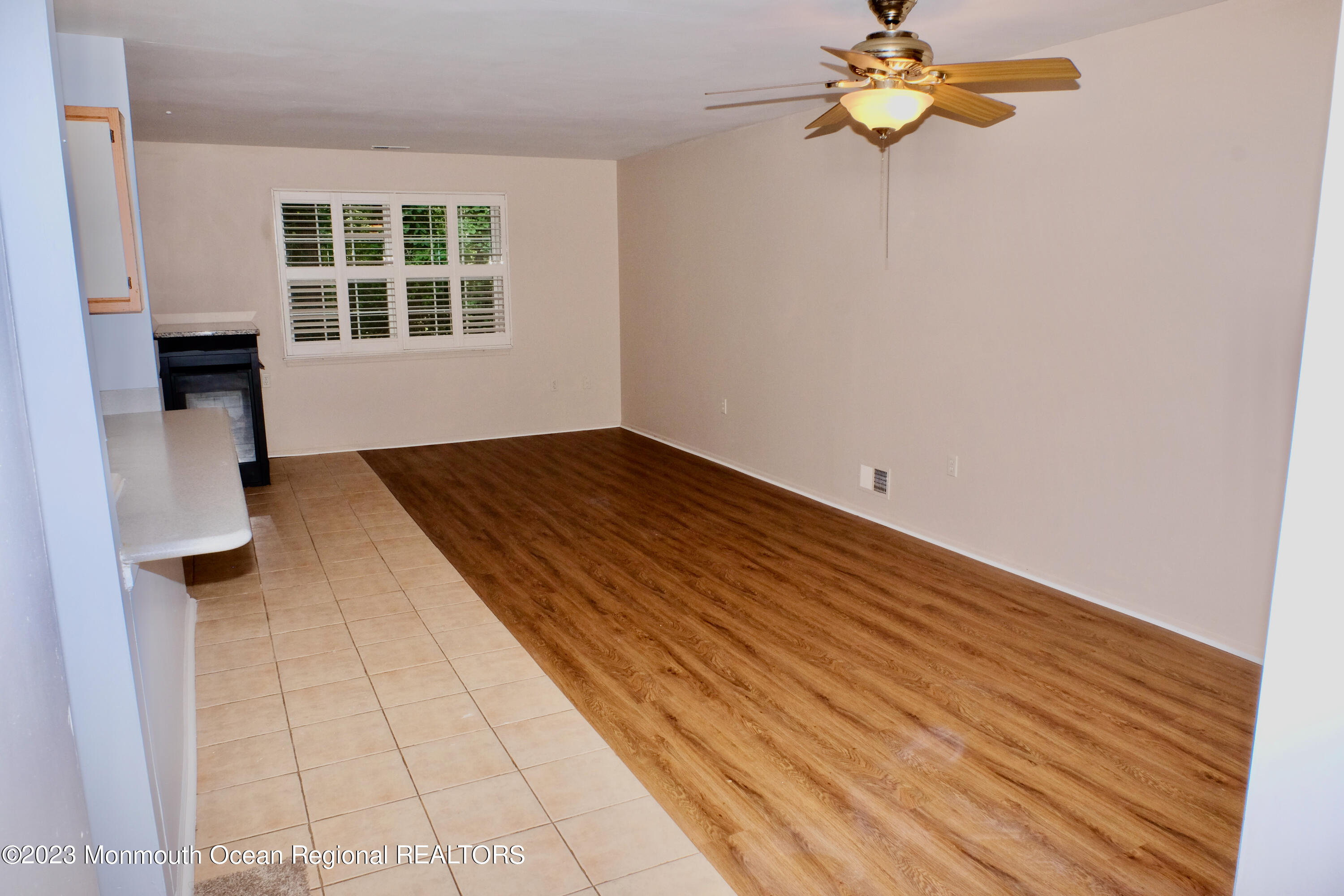 10 Commons Drive Neptune Township, NJ 07753 - Photo 7 of 21 wooden floor in an empty room with a window