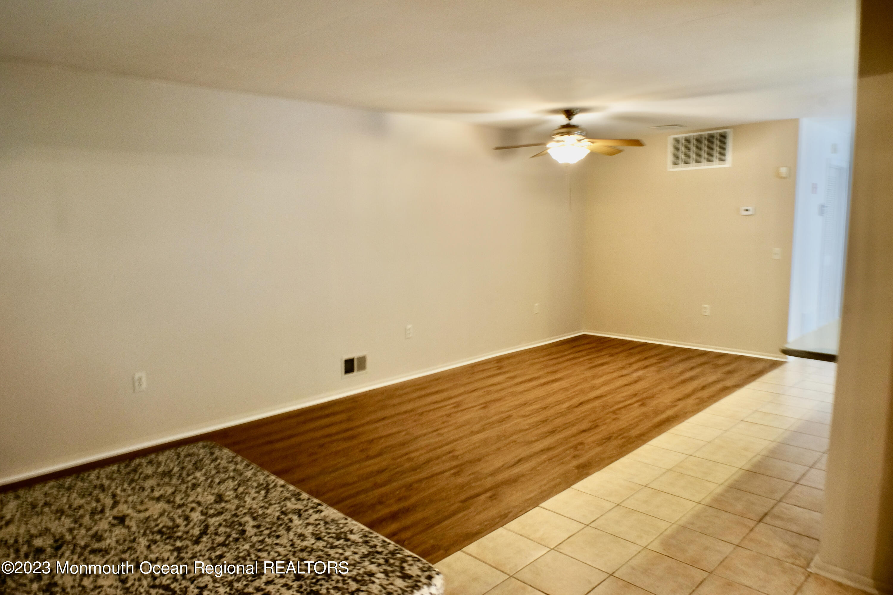 10 Commons Drive Neptune Township, NJ 07753 - Photo 8 of 21 a view of empty room with wooden floor
