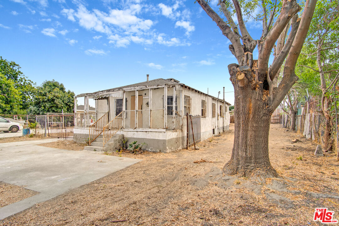 2028 East 126th Street Compton, CA 90222 - Photo 14 of 33 a view of large house with a large tree
