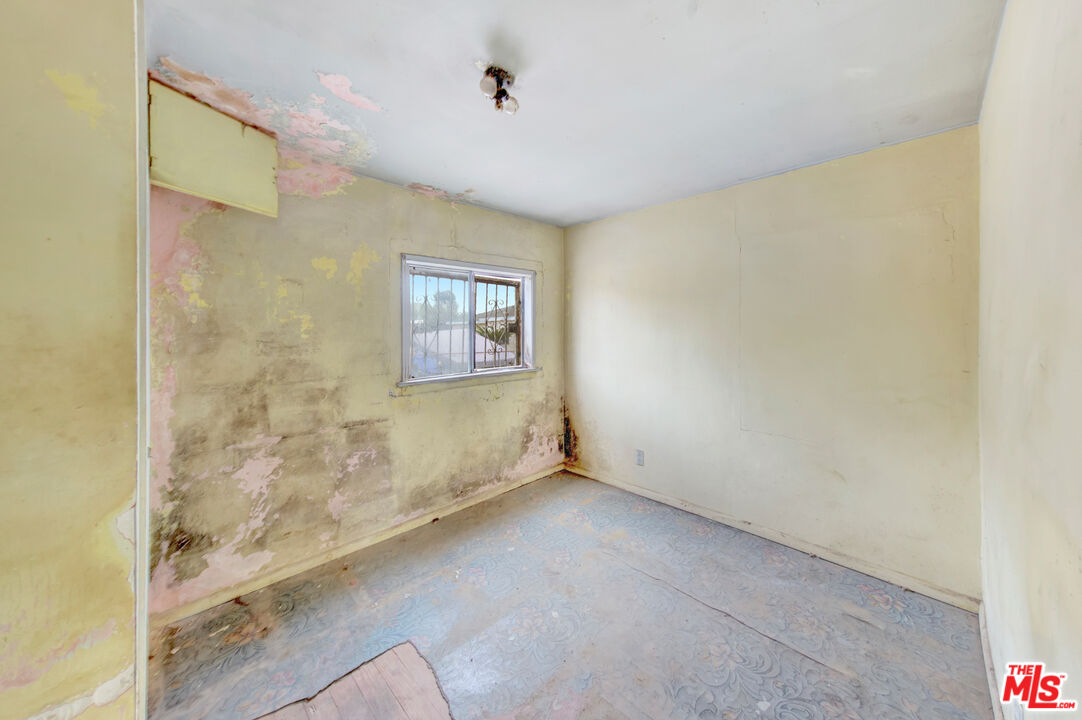 2028 East 126th Street Compton, CA 90222 - Photo 23 of 33 a view of an empty room with a window