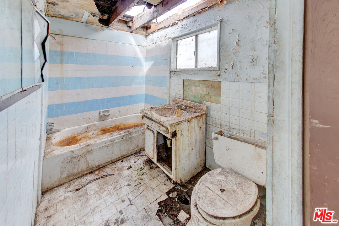 2028 East 126th Street Compton, CA 90222 - Photo 25 of 33 a bathroom with a sink toilet and shower