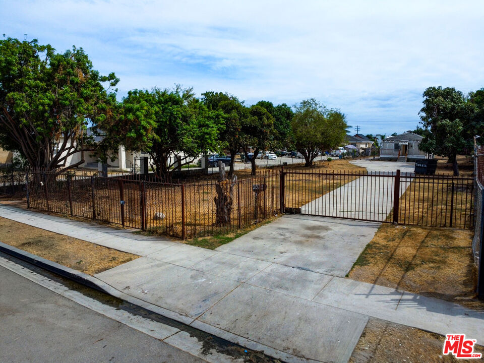 2028 East 126th Street Compton, CA 90222 - Photo 3 of 33 a view of swimming pool with seating space and trees in the background