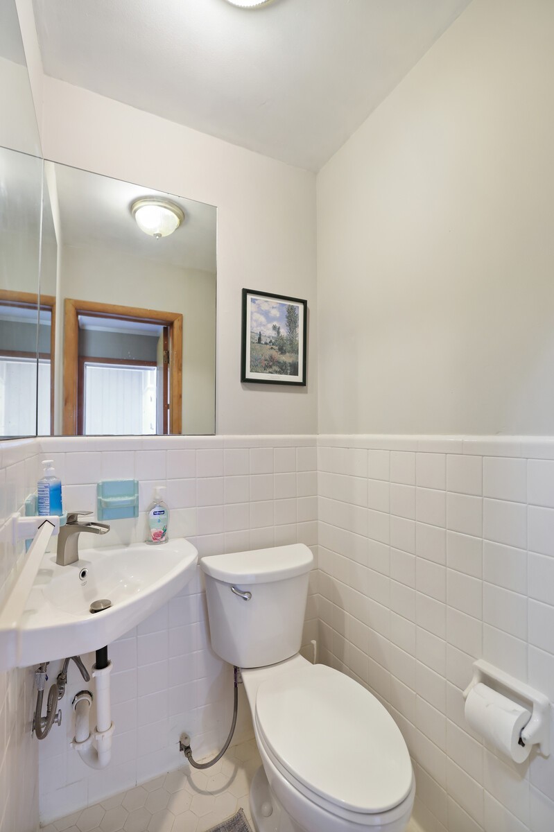 676 Ferguson Hill Road Lafayette, TN 37083 - Photo 24 of 89 a bathroom with a toilet a sink and mirror