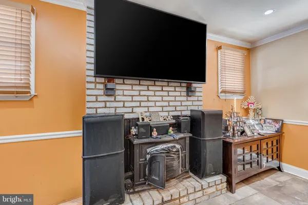 a kitchen with stainless steel appliances kitchen island granite countertop a sink stove and refrigerator