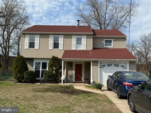 a front view of a house with a garden and porch