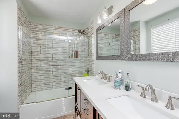 a bathroom with a sink and a shower