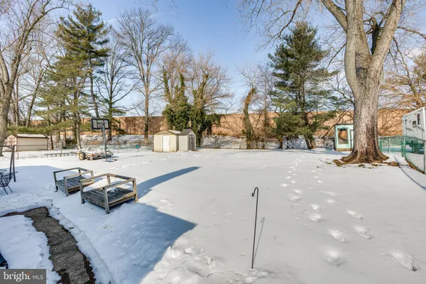 a view of a house with a small backyard