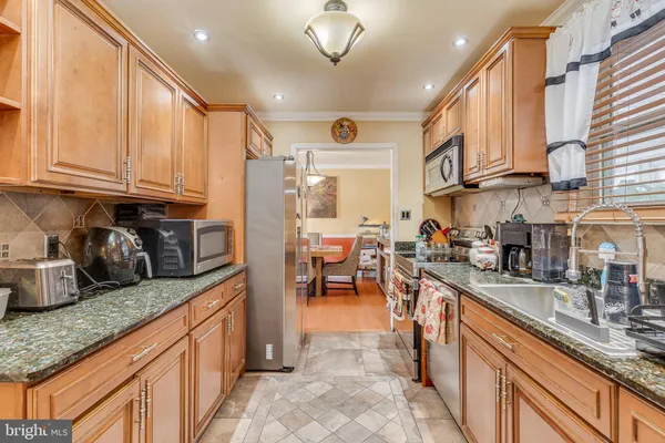 a kitchen with granite countertop lots of counter top space