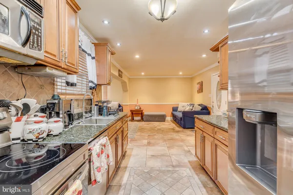 a kitchen with stainless steel appliances granite countertop lots of counter top space