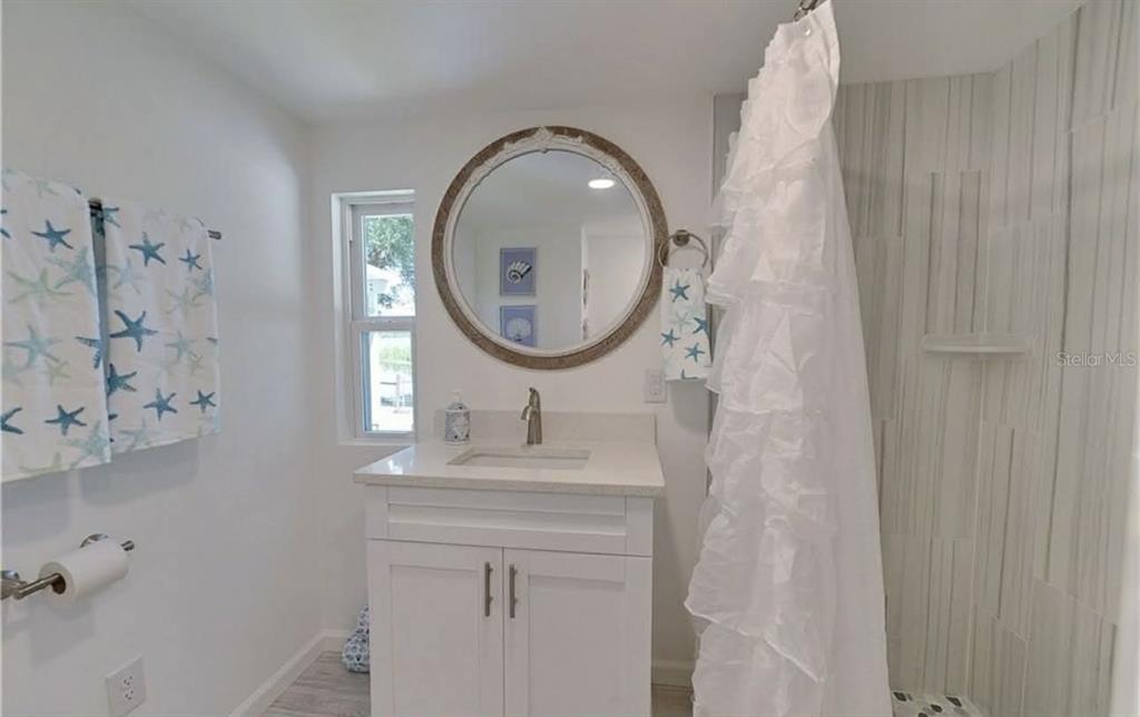 8164 East Turner Camp Road Inverness, FL 34453 - Photo 13 of 39 a bathroom with a sink and a mirror