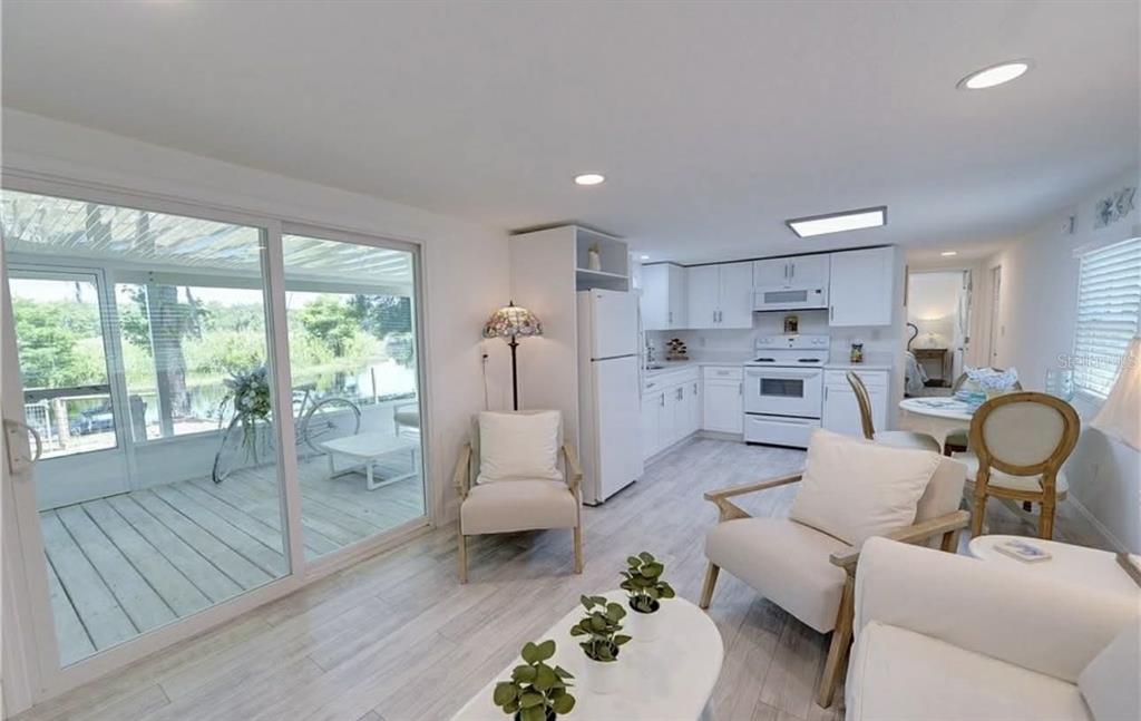 8164 East Turner Camp Road Inverness, FL 34453 - Photo 17 of 39 a living room with furniture and view of kitchen