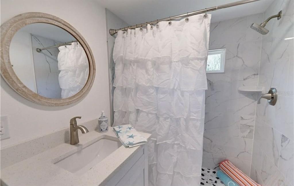 8164 East Turner Camp Road Inverness, FL 34453 - Photo 21 of 39 a bathroom with a sink and a mirror