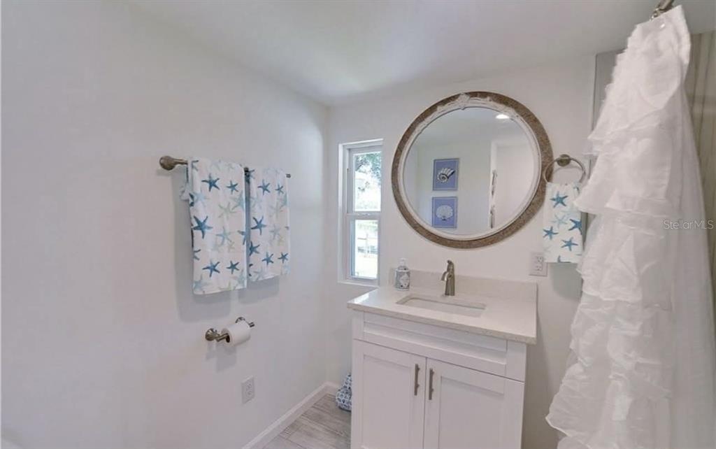 8164 East Turner Camp Road Inverness, FL 34453 - Photo 23 of 39 a bathroom with a sink and a mirror