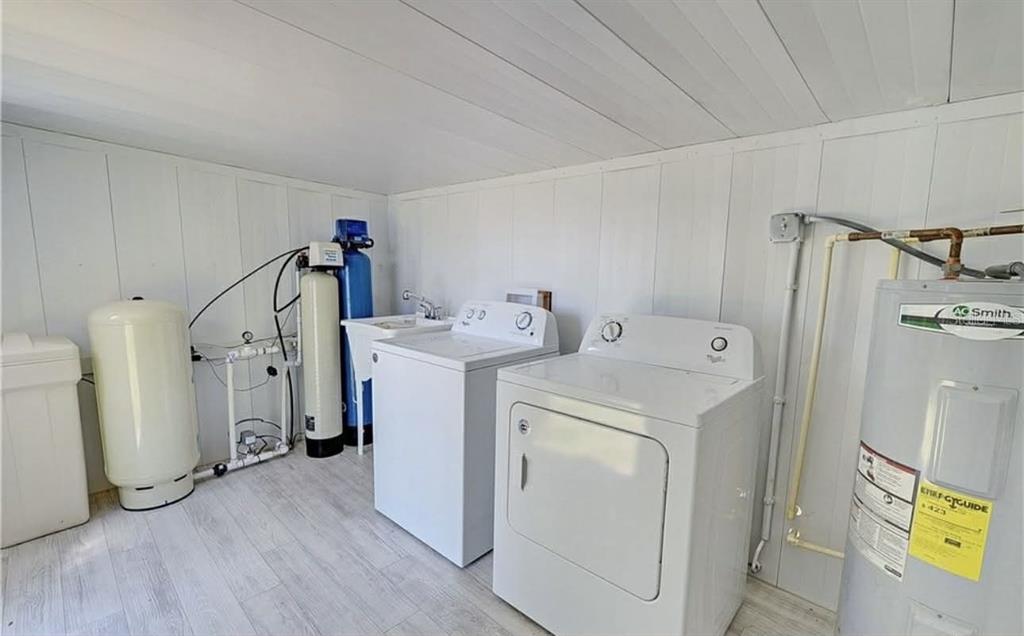 8164 East Turner Camp Road Inverness, FL 34453 - Photo 24 of 39 a utility room with dryer and washer