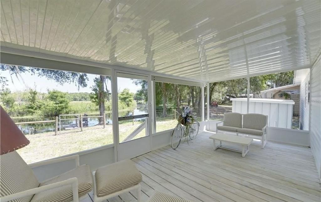 8164 East Turner Camp Road Inverness, FL 34453 - Photo 26 of 39 a living room with furniture and a large window