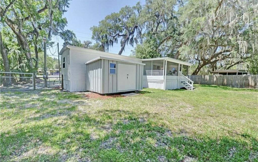 8164 East Turner Camp Road Inverness, FL 34453 - Photo 30 of 39 a view of a house with a yard