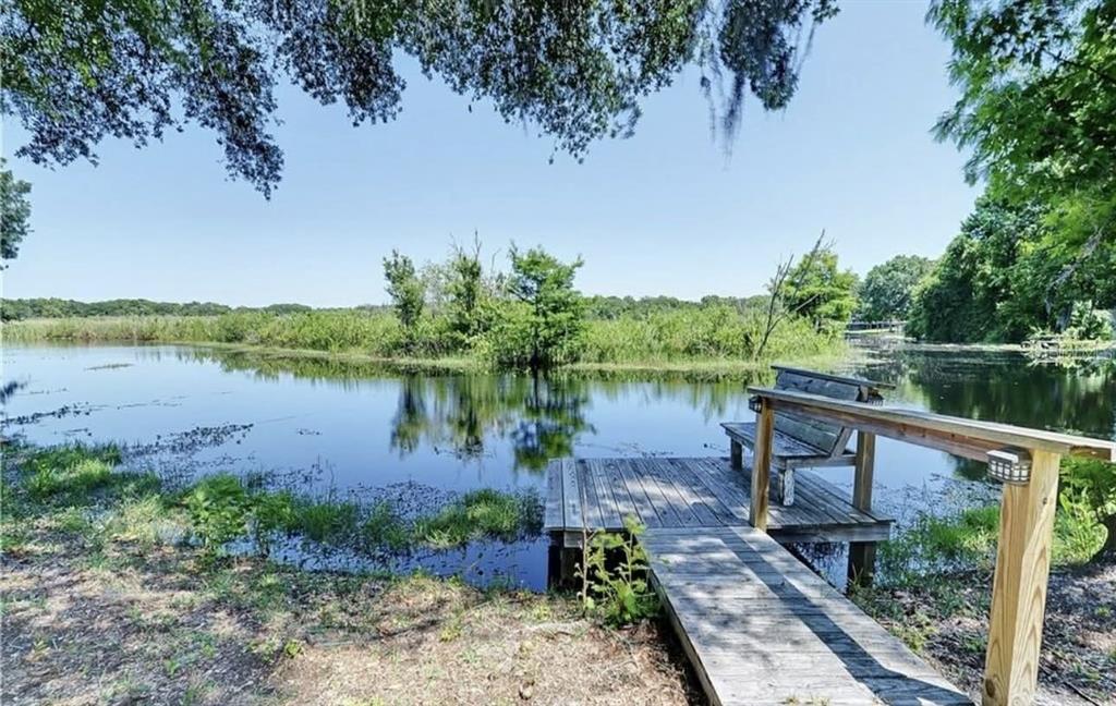 8164 East Turner Camp Road Inverness, FL 34453 - Photo 33 of 39 a view of a lake with a garden and lake view