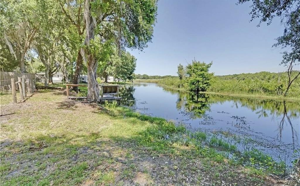 8164 East Turner Camp Road Inverness, FL 34453 - Photo 38 of 39 a view of a lake with a big yard