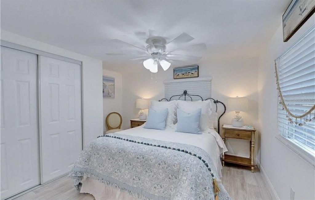 8164 East Turner Camp Road Inverness, FL 34453 - Photo 6 of 39 a bedroom with a bed and a chandelier