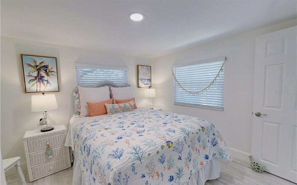 8164 East Turner Camp Road Inverness, FL 34453 - Photo 9 of 39 a bedroom with a large bed and a window