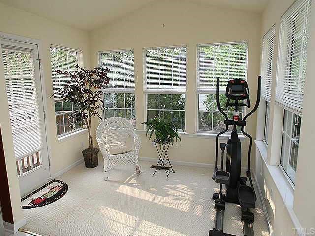 2504 Constitution Drive Raleigh, NC 27615 - Photo 8 of 9 a living room with furniture and a large window