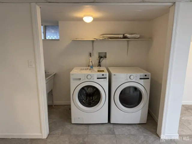 a utility room with dryer and washer