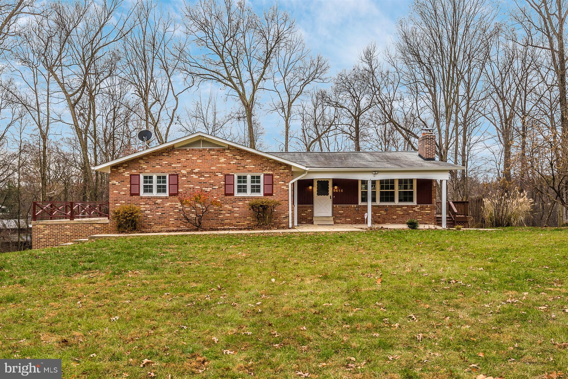 9416 Emory Grove Road Gaithersburg, MD 20877 - Photo 1 of 30 a front view of a house with a garden