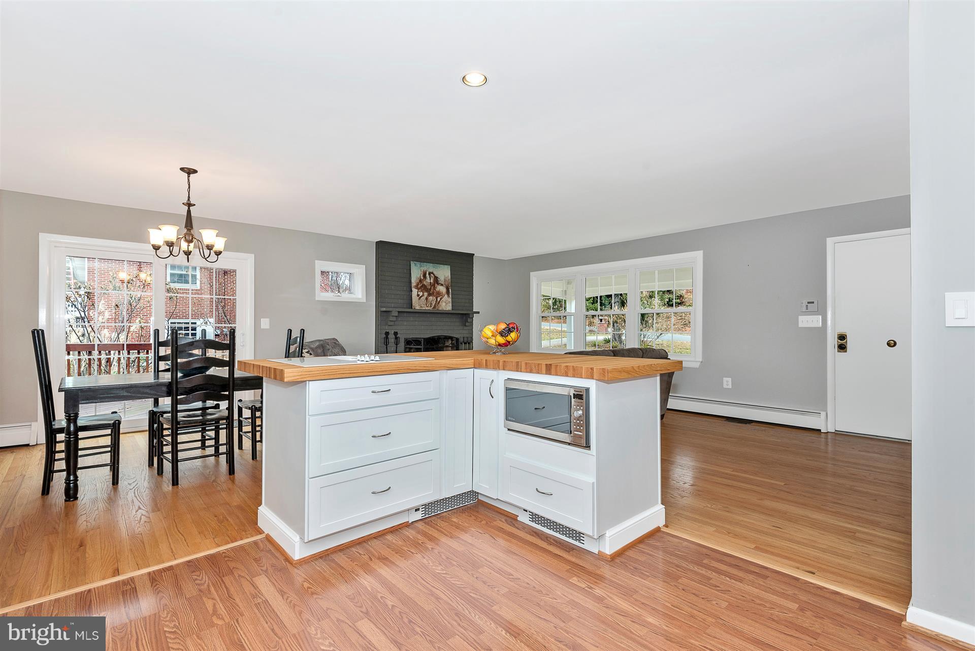 9416 Emory Grove Road Gaithersburg, MD 20877 - Photo 15 of 30 a kitchen with stainless steel appliances granite countertop a stove and wooden floor