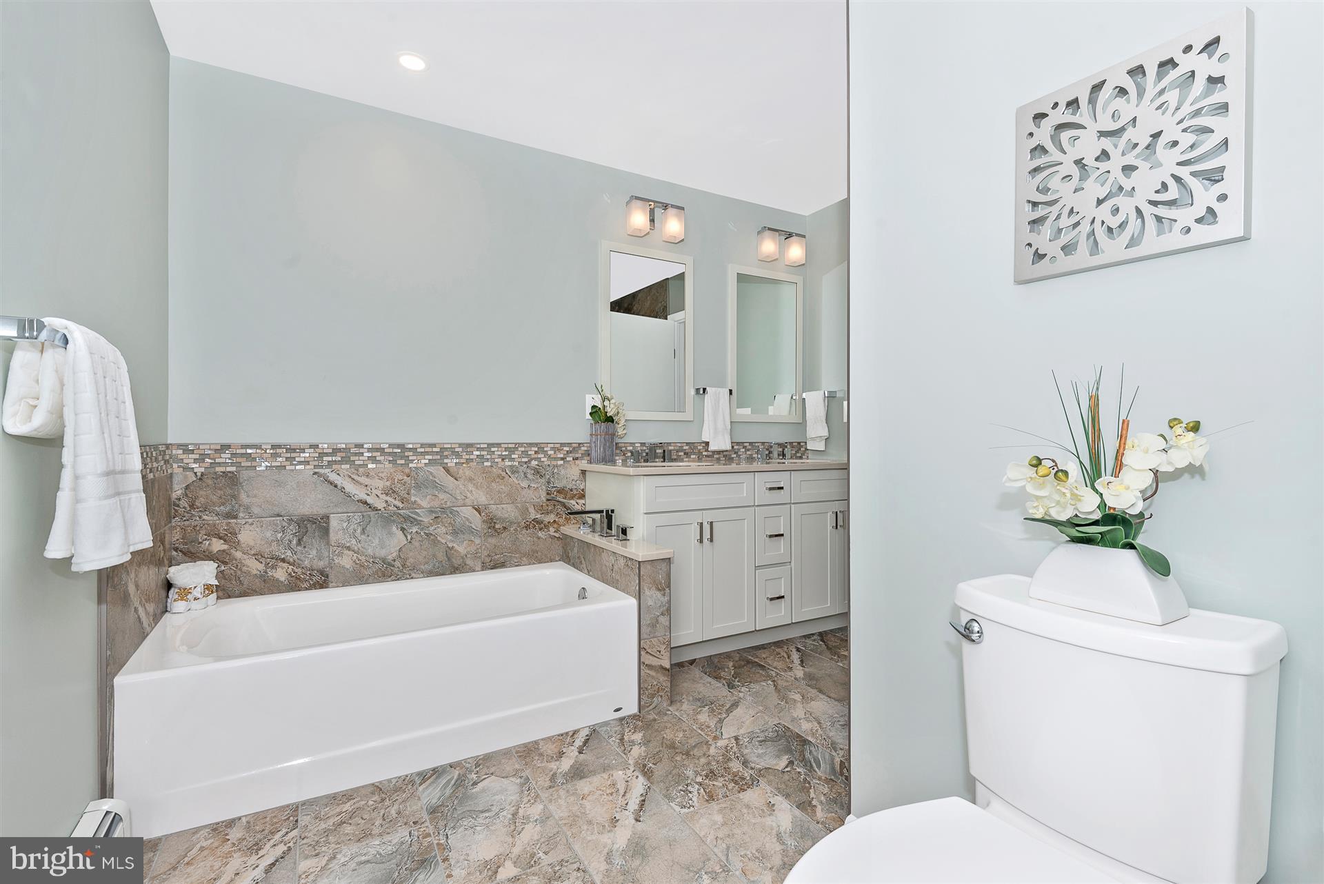 9416 Emory Grove Road Gaithersburg, MD 20877 - Photo 21 of 30 a bathroom with a sink a toilet and tub